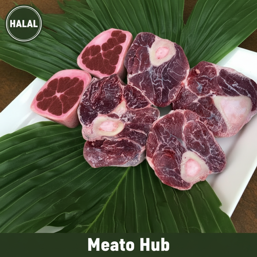 Fresh Halal Beef Shank Bone-In cuts displayed on green leaf styling — premium halal meat, UAE delivery by Meato Hub